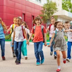 Aws Group Of Young Students Holding Hands And Smiling While Walking